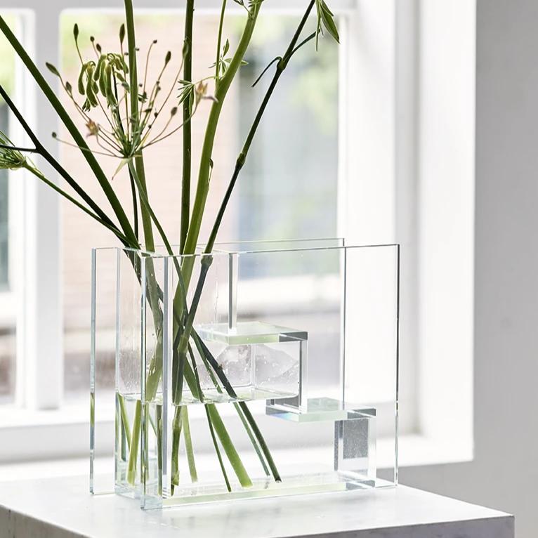 glass staircase vase inspired by dutch painter piet mondriaan with green branches