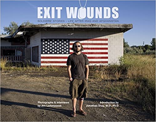 hardcover of photobook about soldiers with veteran and American flag