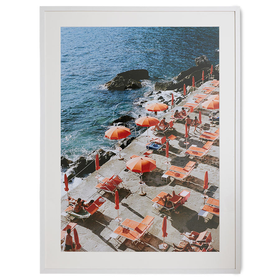 framed photo of orange sun umbrellas along the Amalfi coast