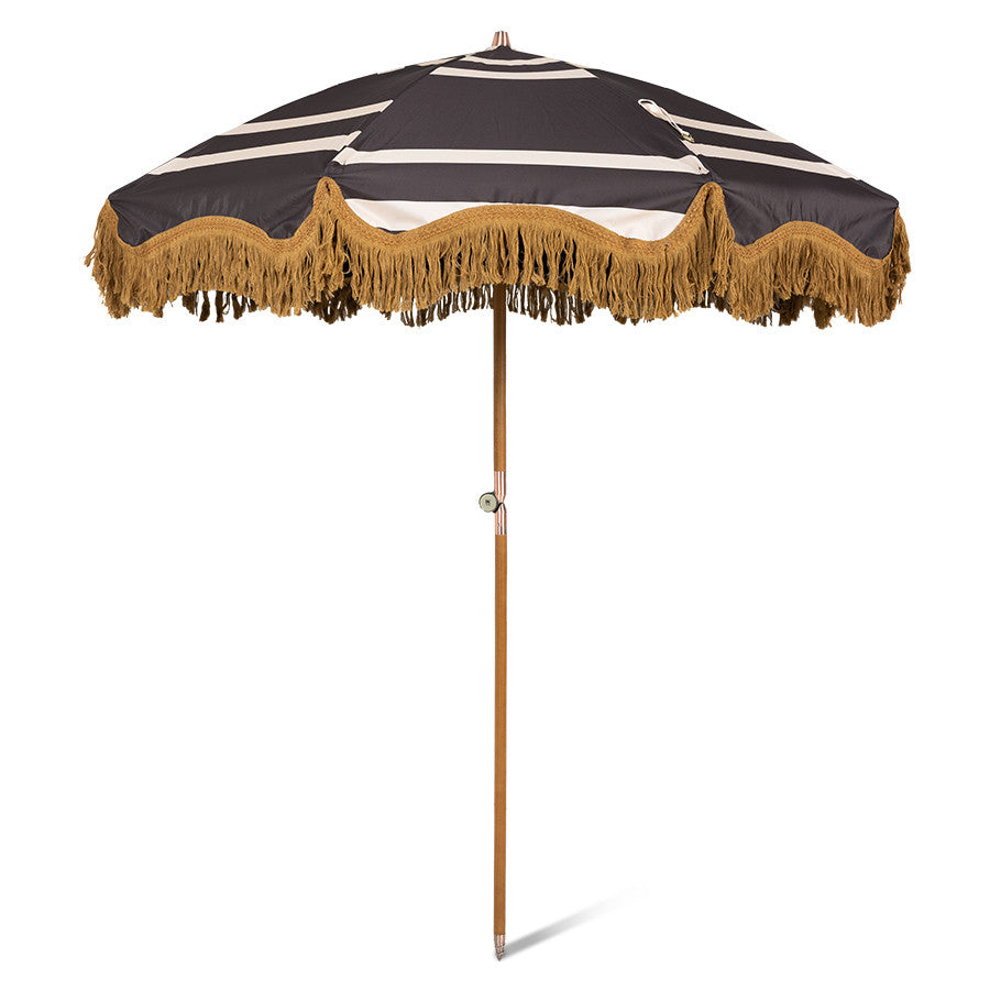 brown and cream graphic design parasol with wooden pole and golden fringes