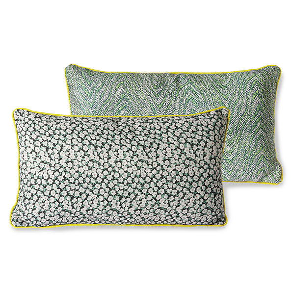 green printed pillow with yellow trim piping