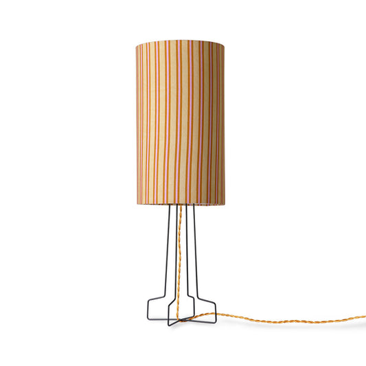 striped table lamp on a black metal open base with golden cord