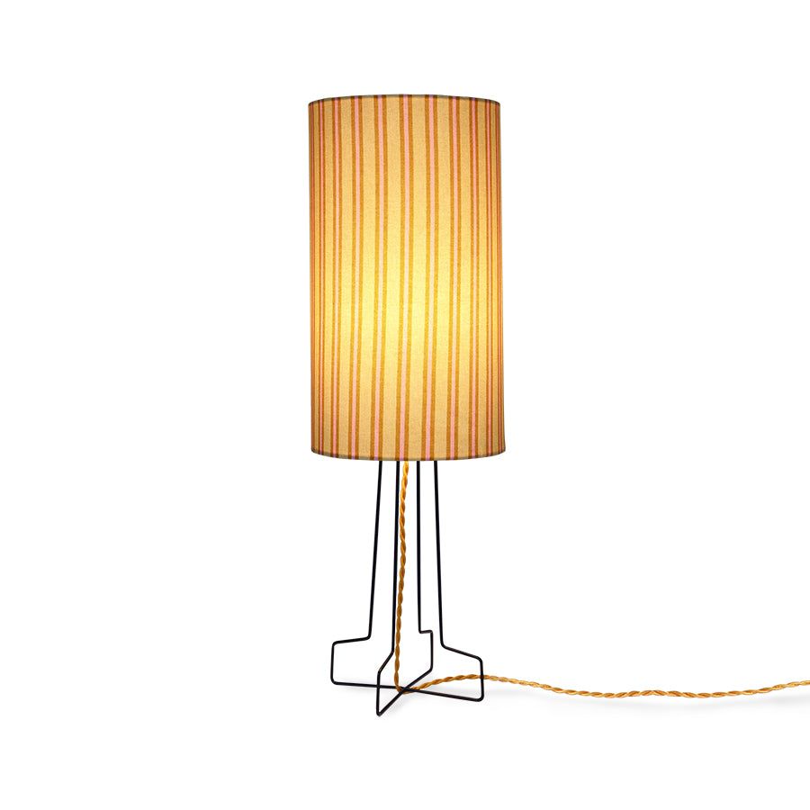 striped table lamp on a black metal open base with golden cord