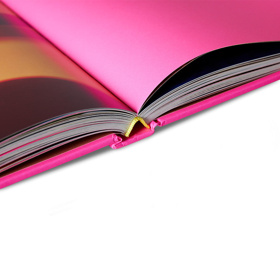 detail of pages from the hardcover bright pink front of HKliving look book
