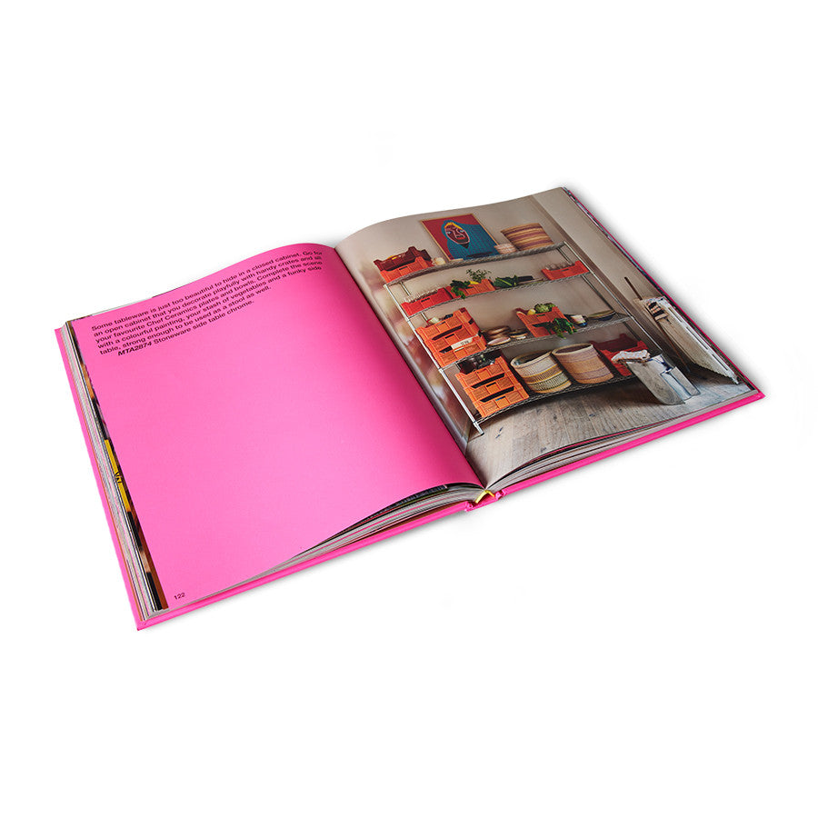 open pages of hardcover bright pink front of HKliving look book