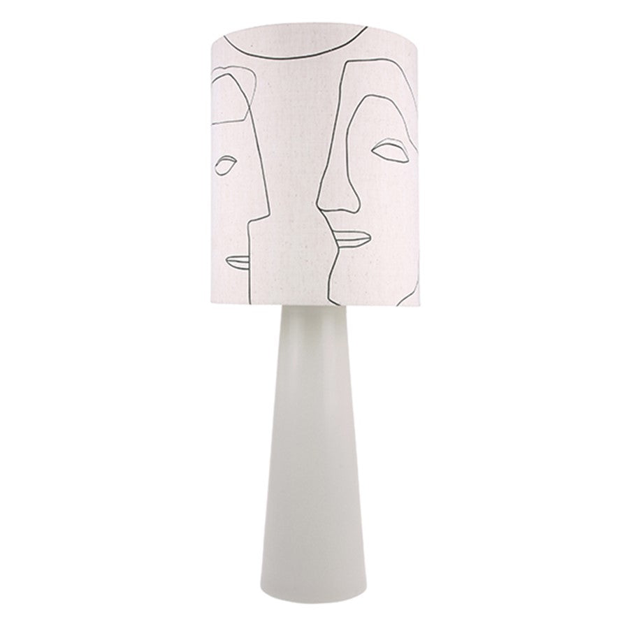 table lamp with faces on it and a grey base